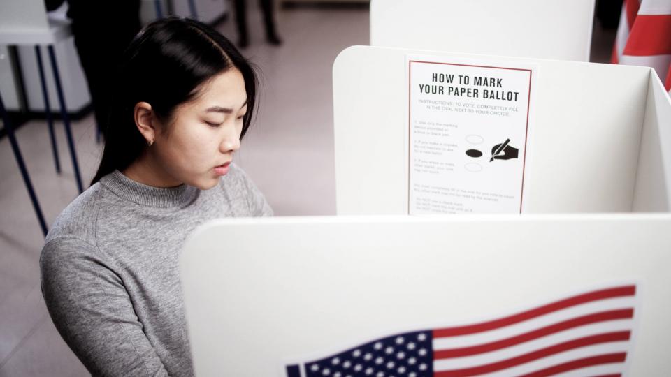 Female student at a voting booth